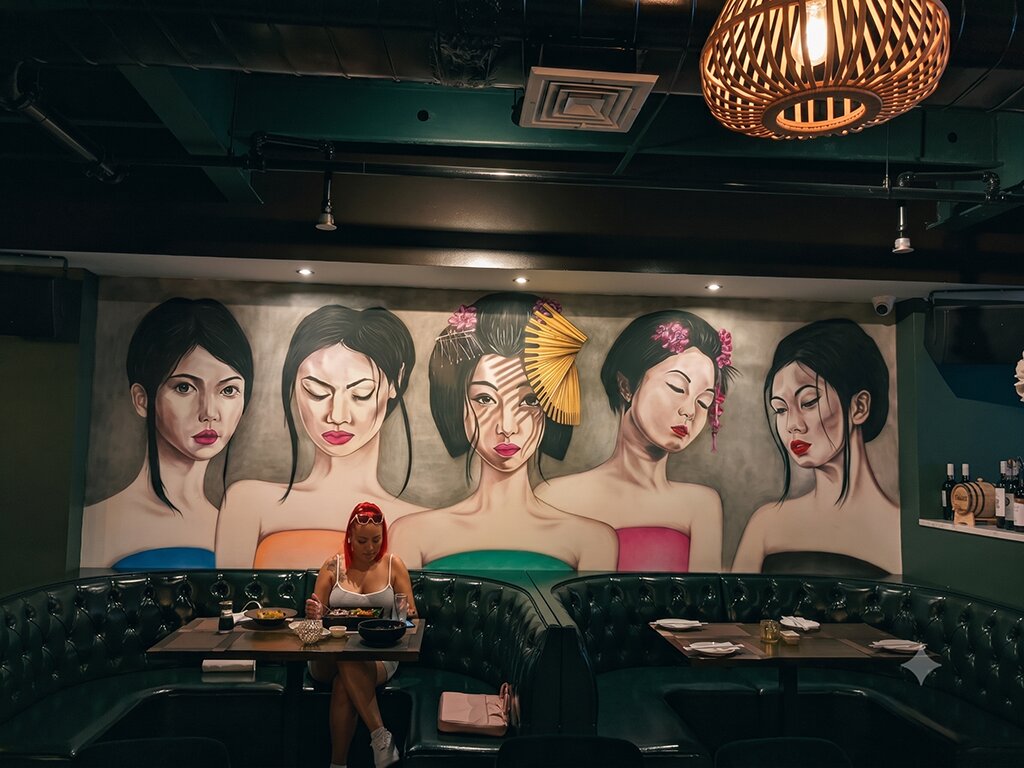 Hand-painted feature-wall mural in a lounge
