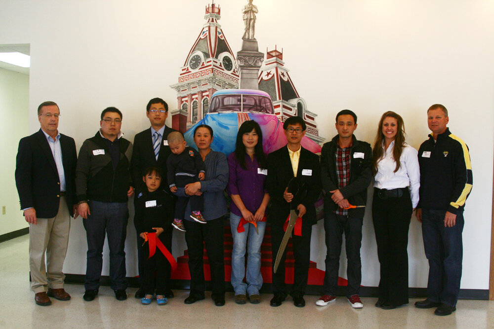 Dongbai Tang with guests at a mural unveiling